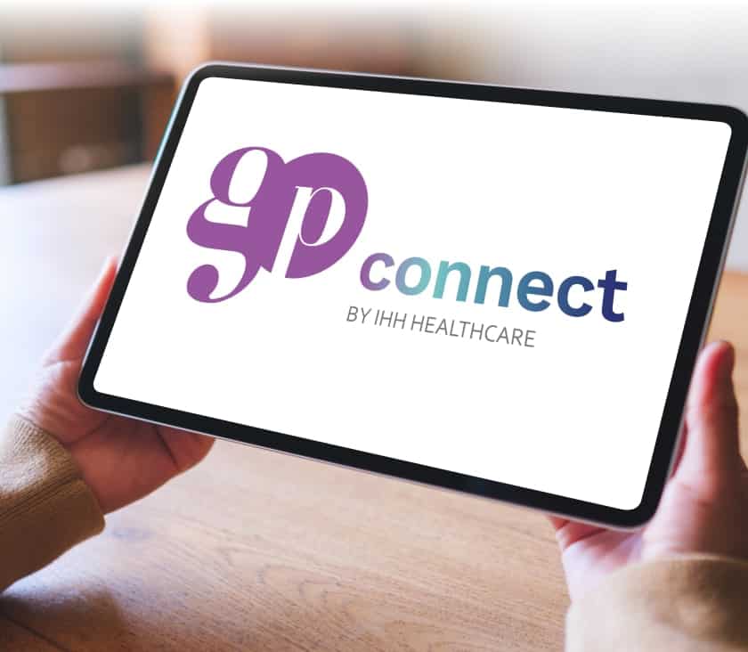 Doctor holding a tablet showing the GP Connect logo