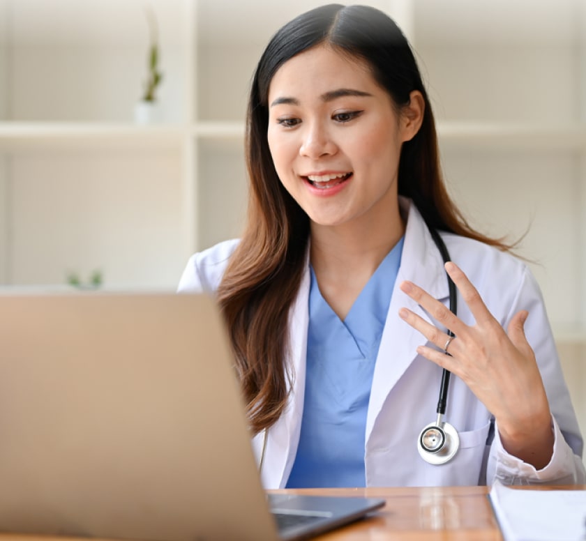 Doctor working at a laptop
